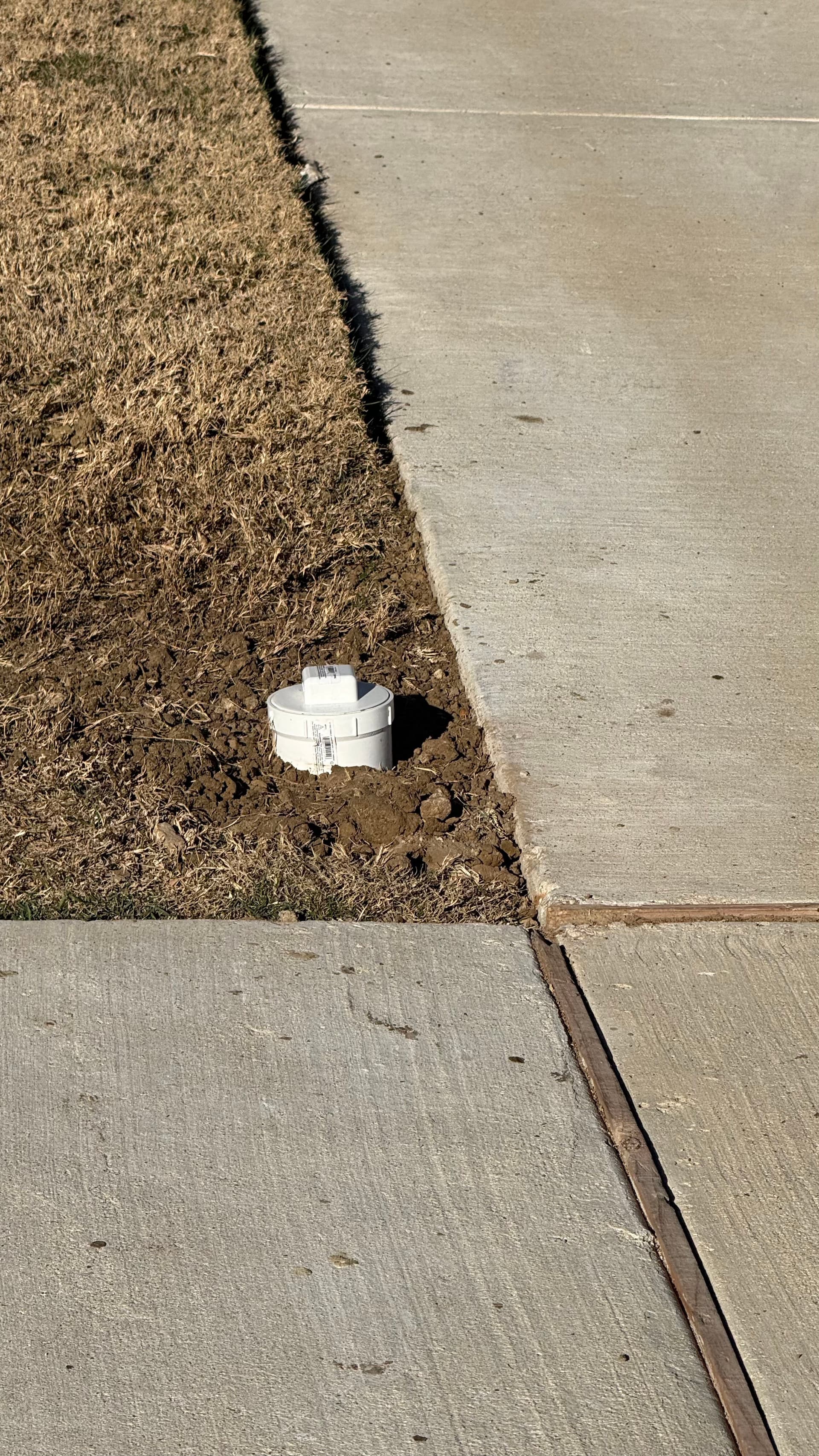 Backed-Over Sewer Cleanout Repaired and Back in Service image